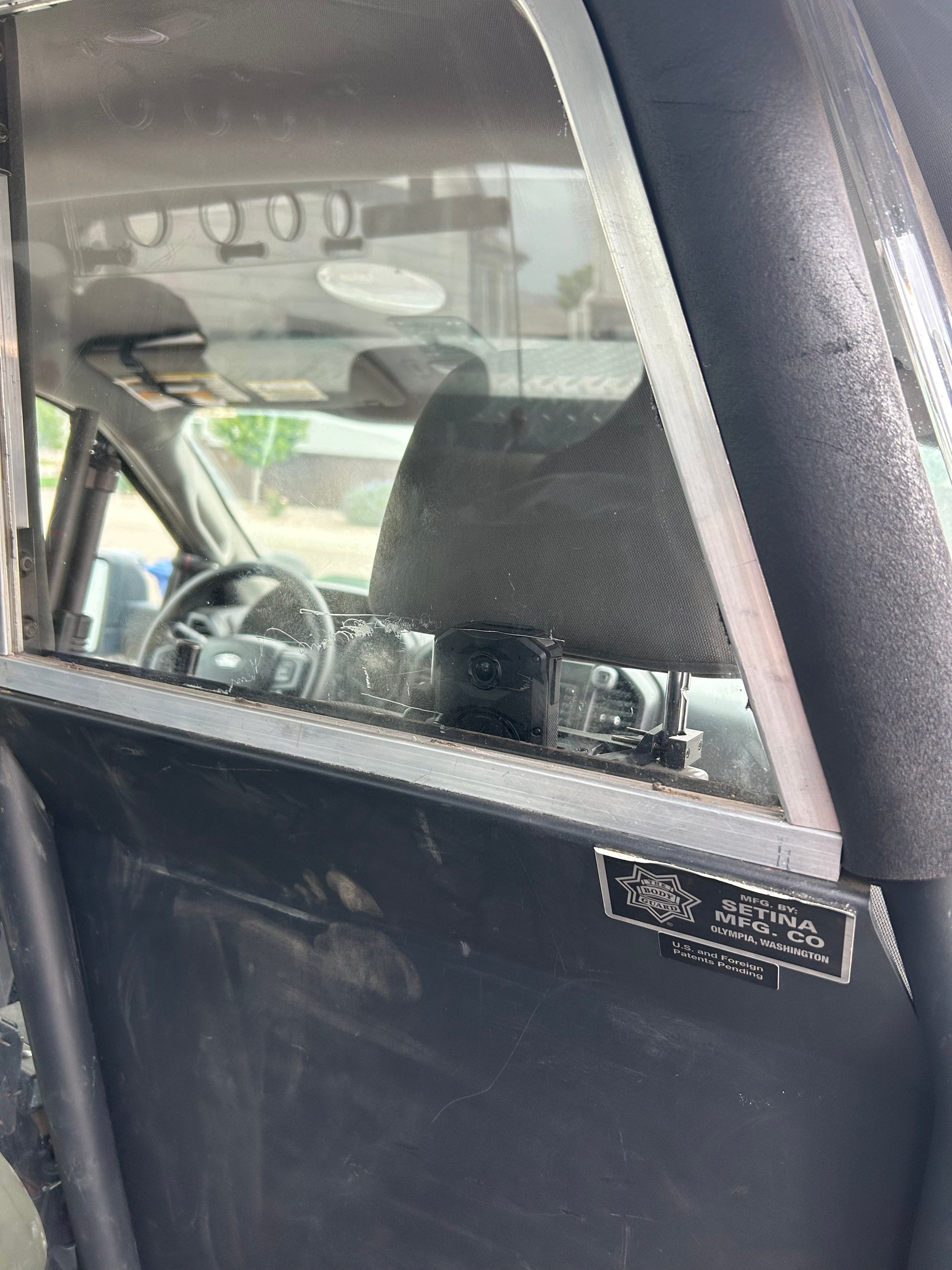 Axon Body Camera held in Body Camera Vehicle Mount gear for officers 
